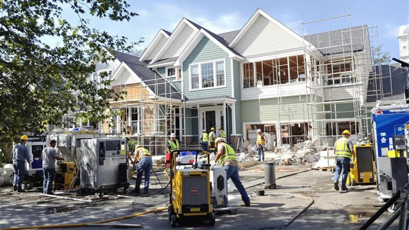 homepage-restoration professional restoration team working on a damaged residential property